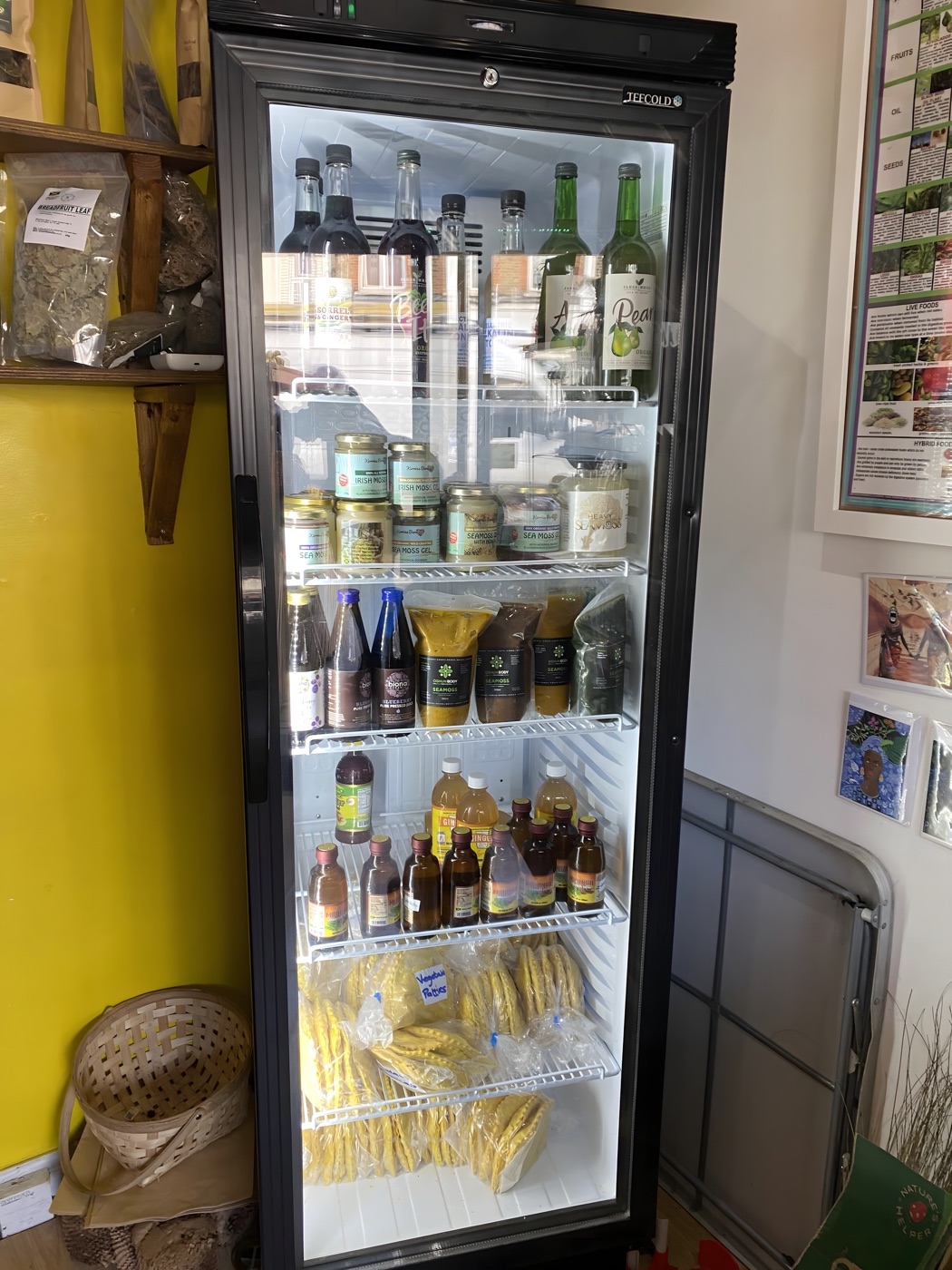 Fridge of sea moss gel, herbal tonics and cold-pressed juices at Alkaline Roots